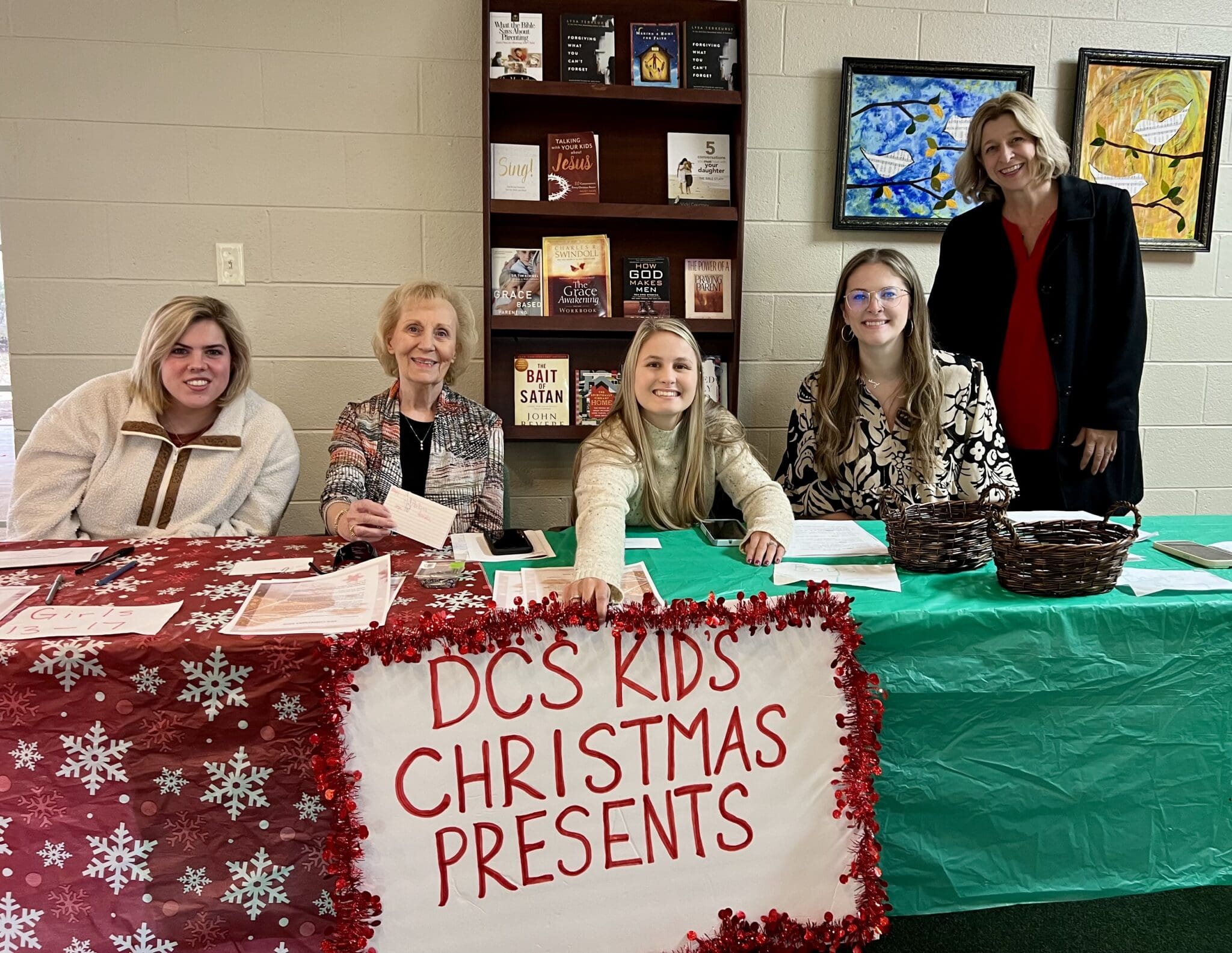 women at donation table