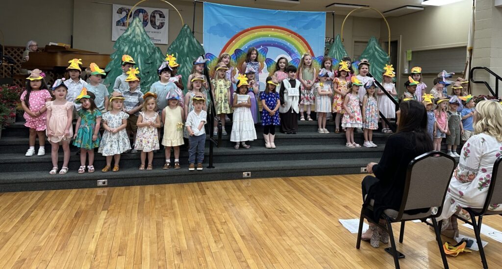 children in choir singing